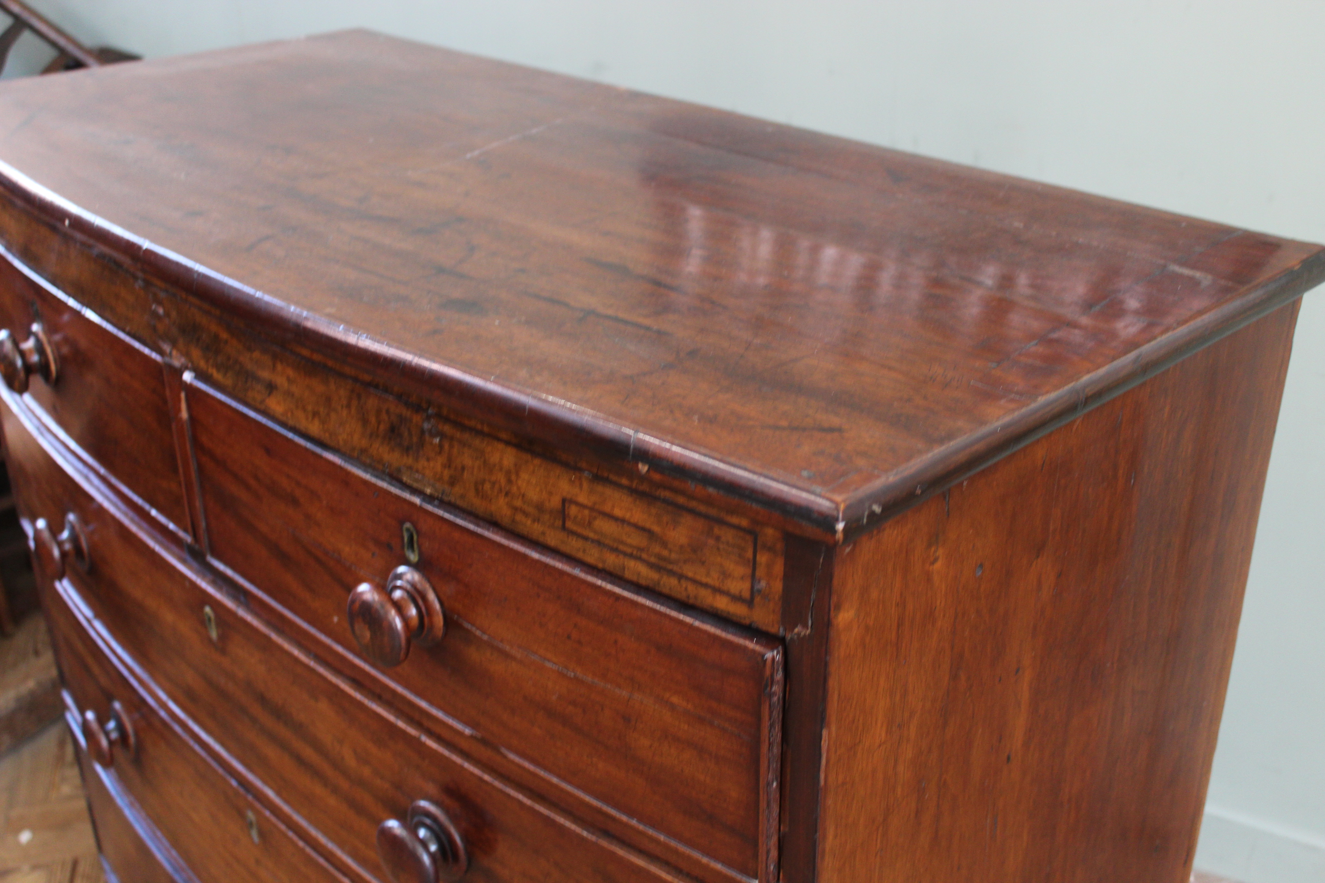 An early 19th Century mahogany chest of six drawers on shaped bracket and apron, - Image 2 of 3