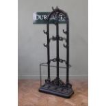 A late 19th Century style iron hallstand with umbrella and drip tray,