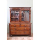 A 19th Century and later mahogany sliding door cupboard on chest