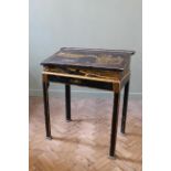 A 19th Century chinoiserie decorated desk on square chamfered legs,