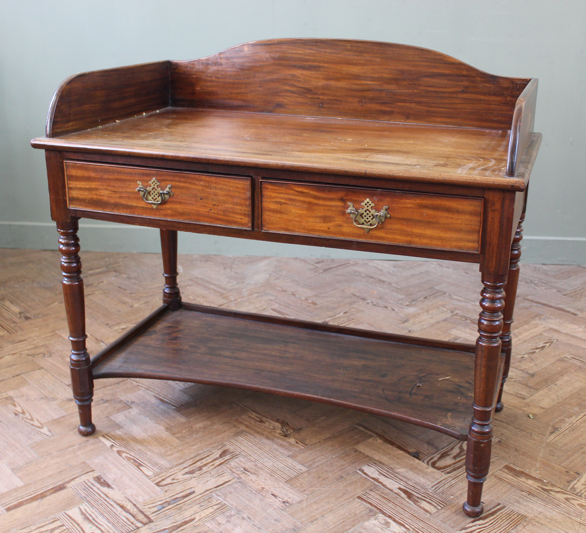 A mid 19th Century mahogany two drawer washstand with under tier,