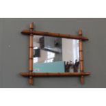 A 19th Century French faux bamboo wall mirror,