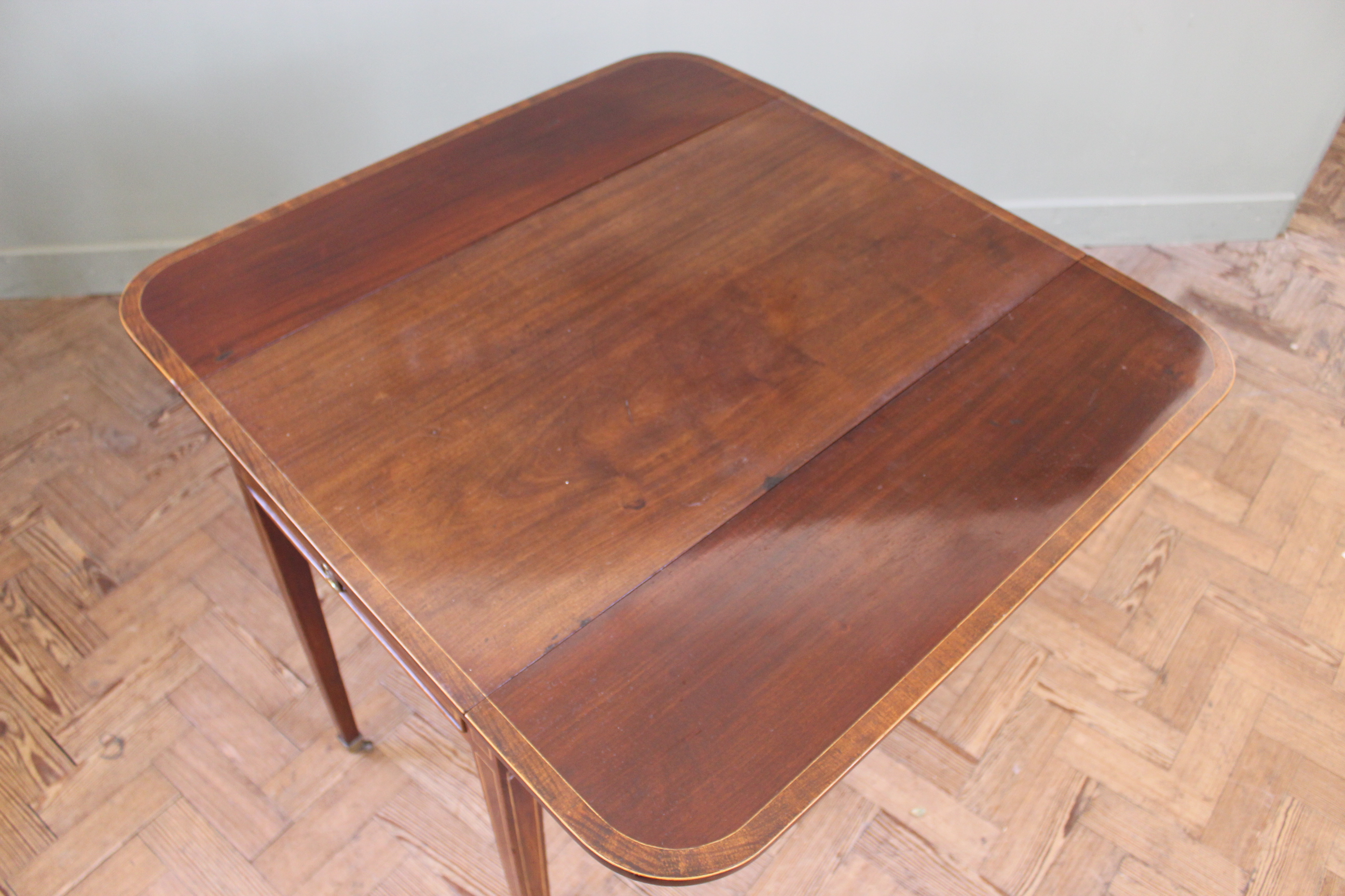 An early 19th Century mahogany inlaid Pembroke table on square tapered legs and brass box castors, - Image 3 of 3