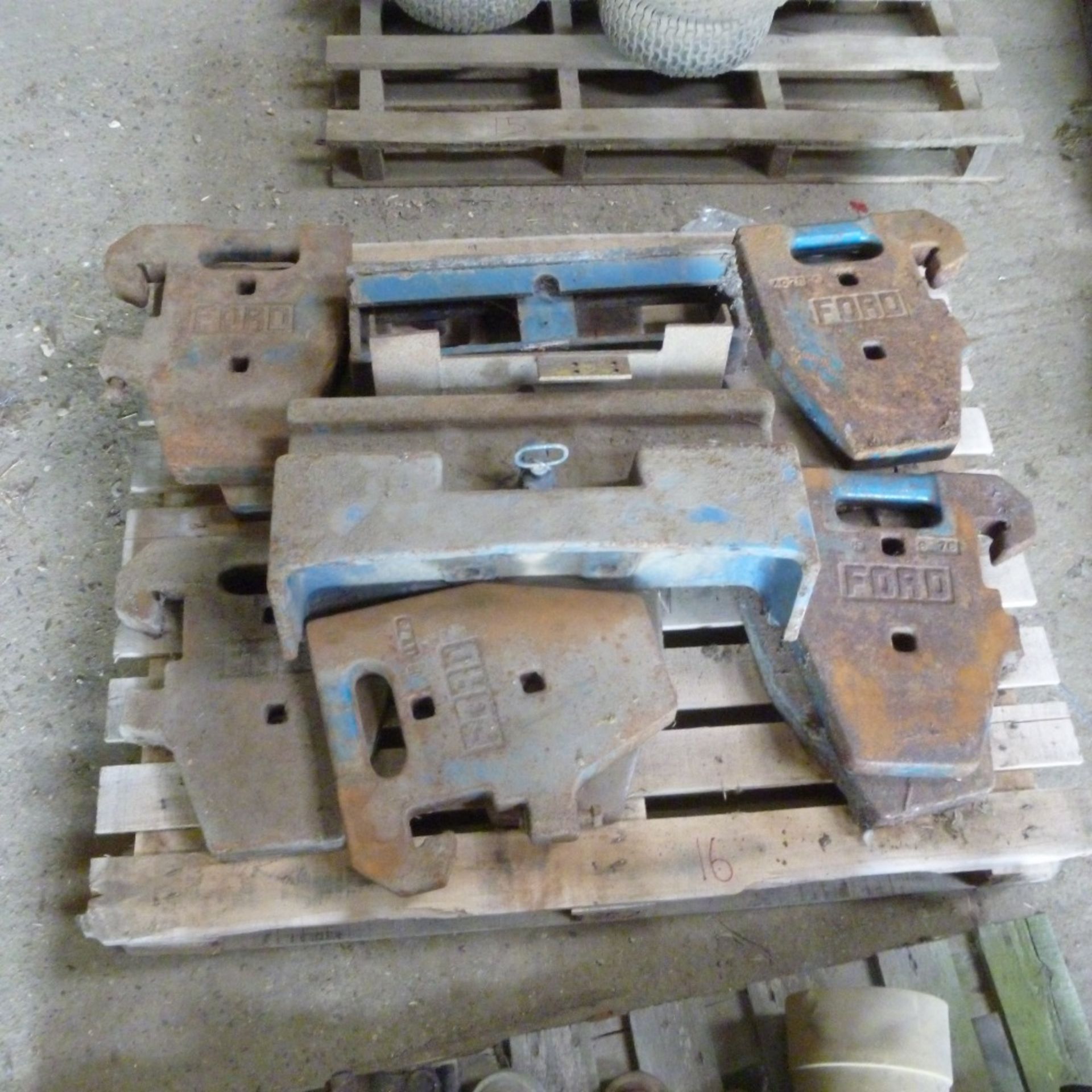 Pallet of Ford weights and frame