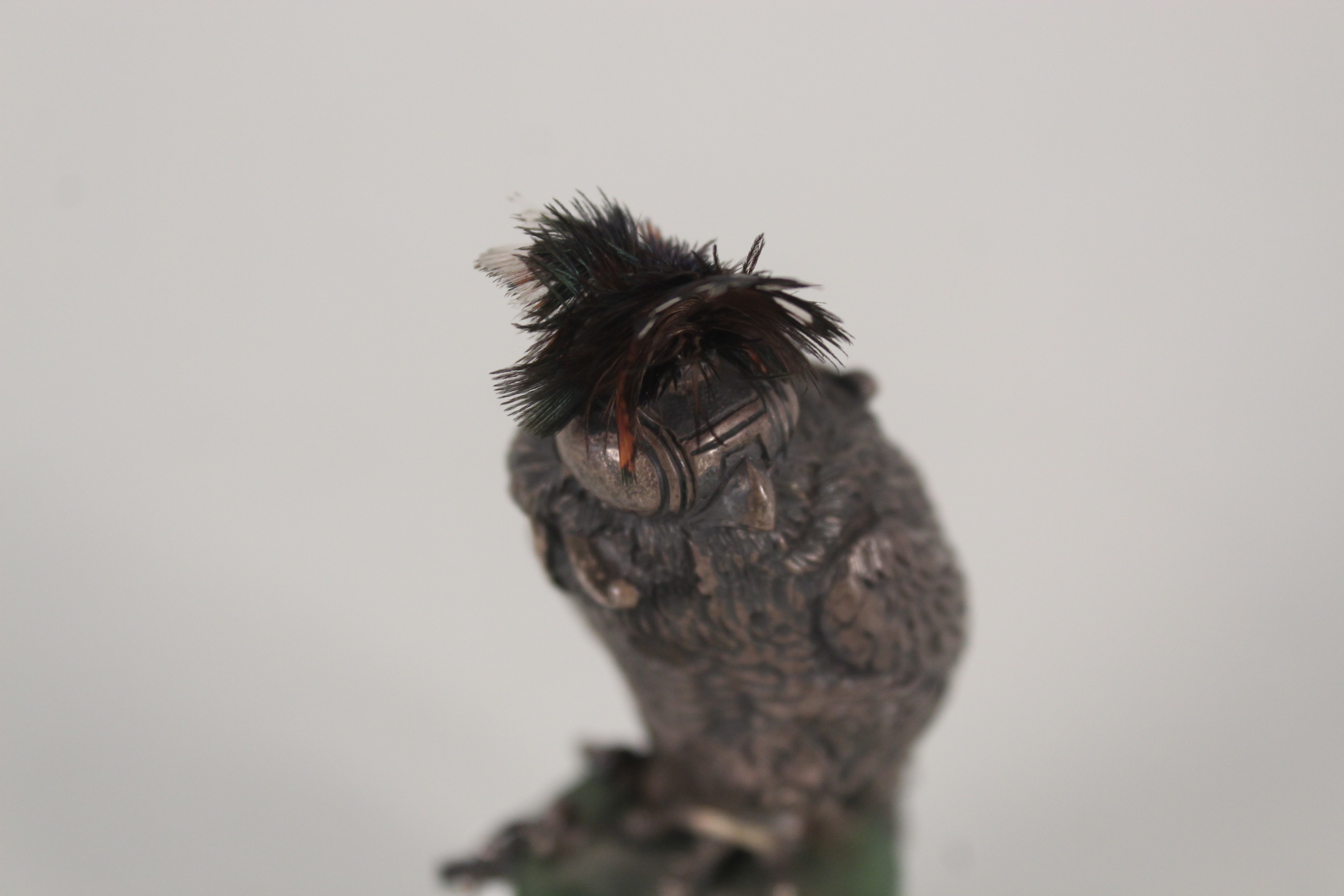 A silver model of a hawk with real feathers on top, mounted on green stone base hallmarked London, - Image 2 of 2