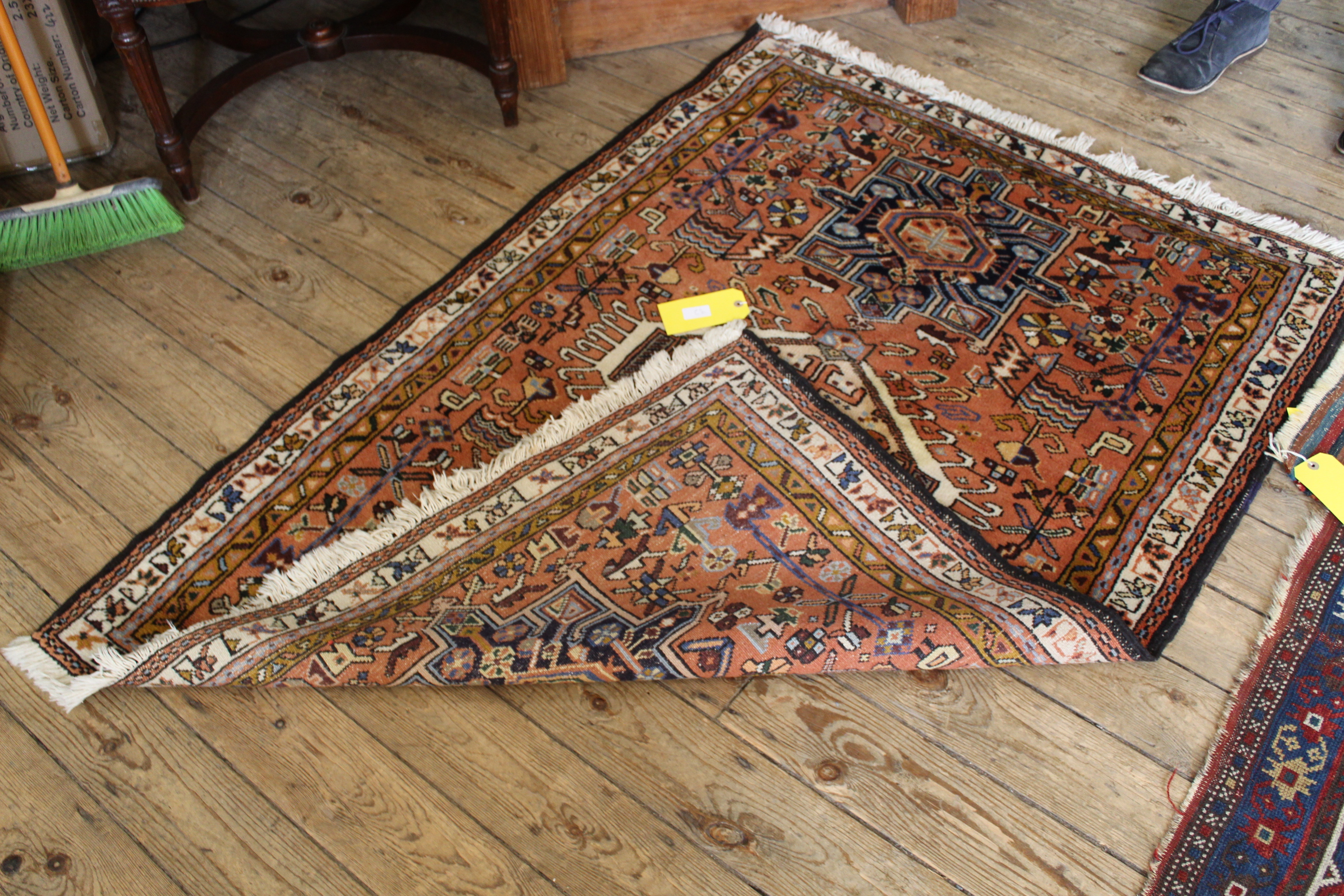 A Persian Abadeh rug with geometric medallions on a pink ground, - Image 2 of 3