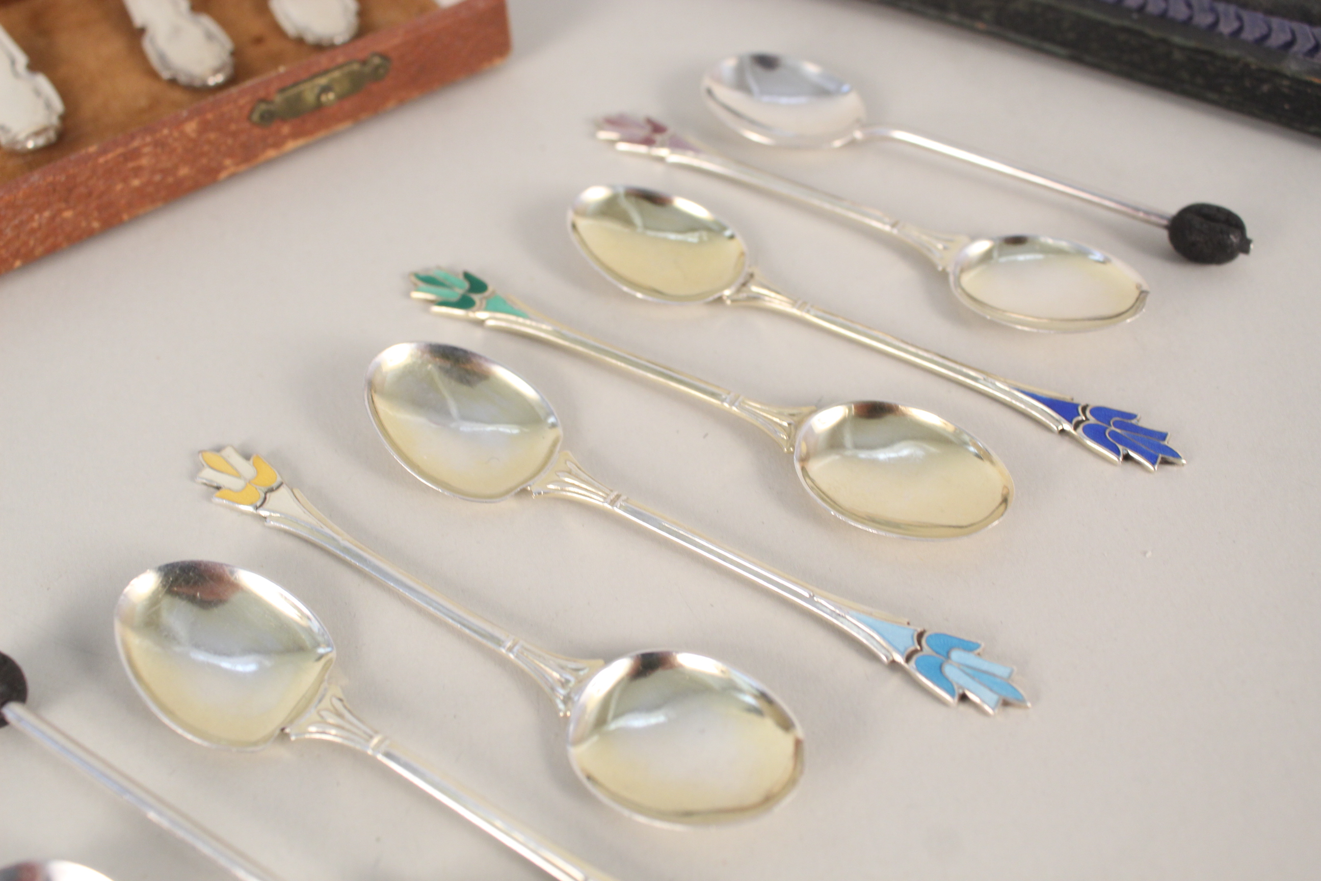 A collection of silver spoons including a set of six enamelled teaspoons (two are damaged), - Image 2 of 4