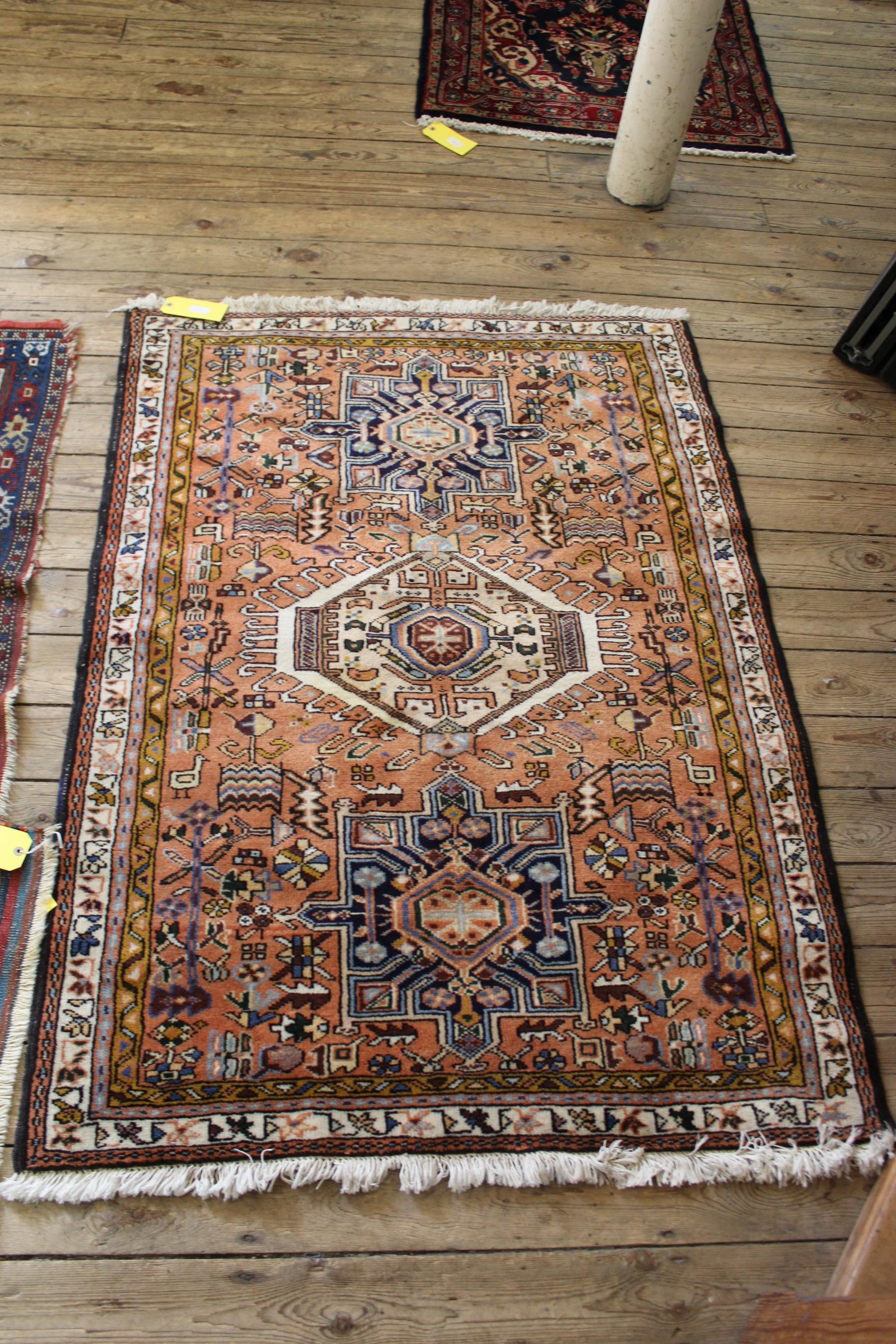 A Persian Abadeh rug with geometric medallions on a pink ground, - Image 3 of 3