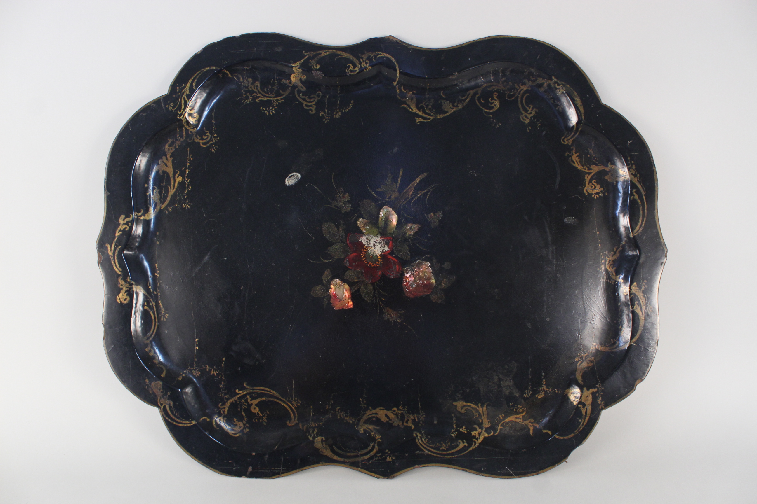 A large Victorian papier mache tray with gilding and painted centre (rim chips and age related