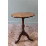 An early 19th Century mahogany flip top tripod table