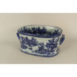 Blue and white slipper bath with classical scenes of figures in landscape, 18" wide,