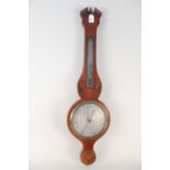 An early 19th Century mahogany case banjo barometer with Sheraton style shell inlay,