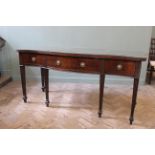 A George III mahogany Serpentine fronted serving table,