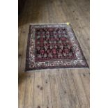 A Hamadan rug with white border,