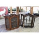 Two vintage oak collectors display cabinets, one with key,