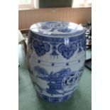 A Chinese ceramic garden seat plus a blue and white decoration with pagodas and landscape