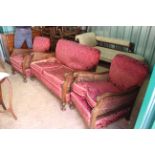 An oak framed two seater rattan sofa plus two armchairs