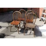 A set of four beech and elm stick back chairs