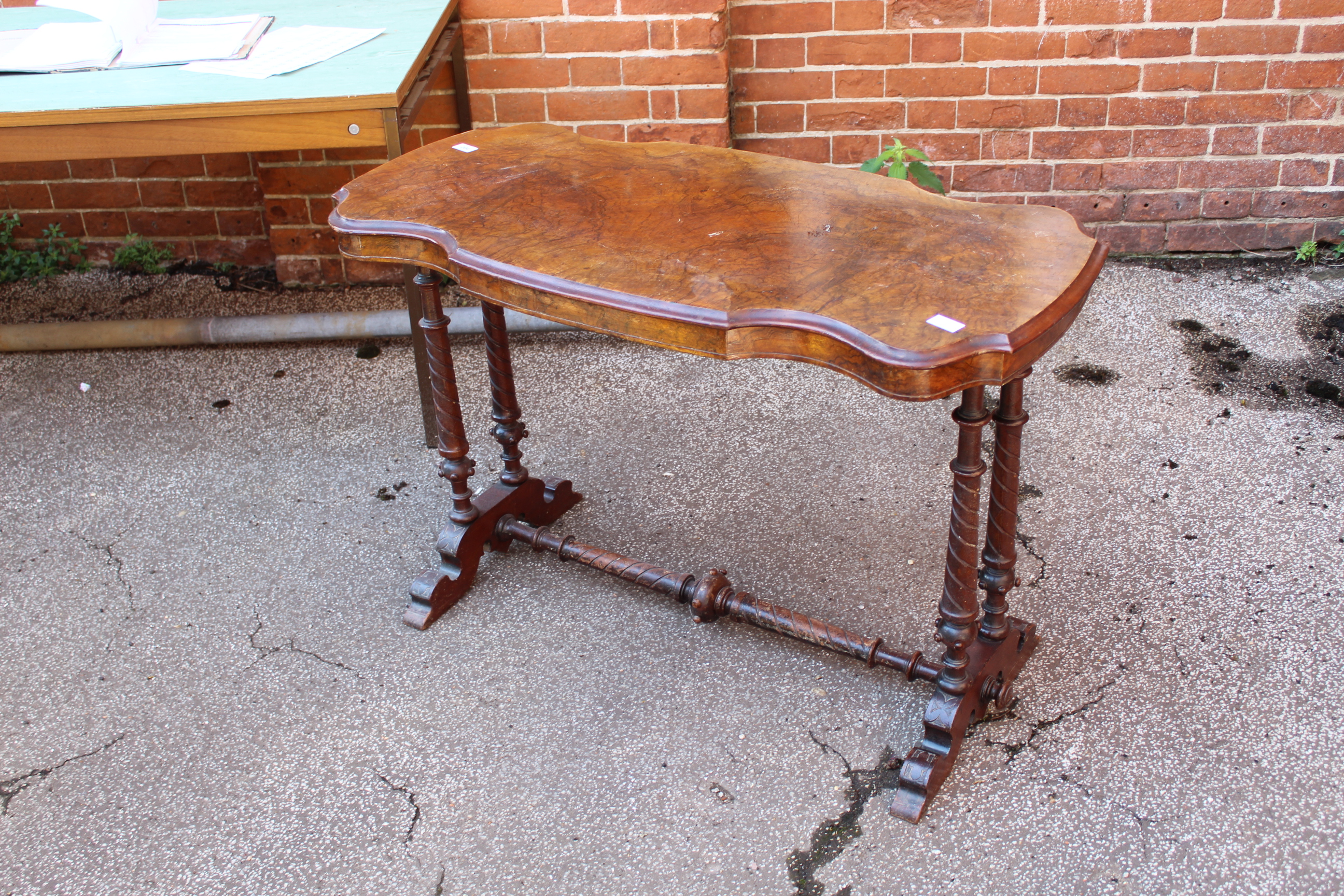 A Victorian walnut stretcher table