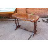 A Victorian walnut stretcher table