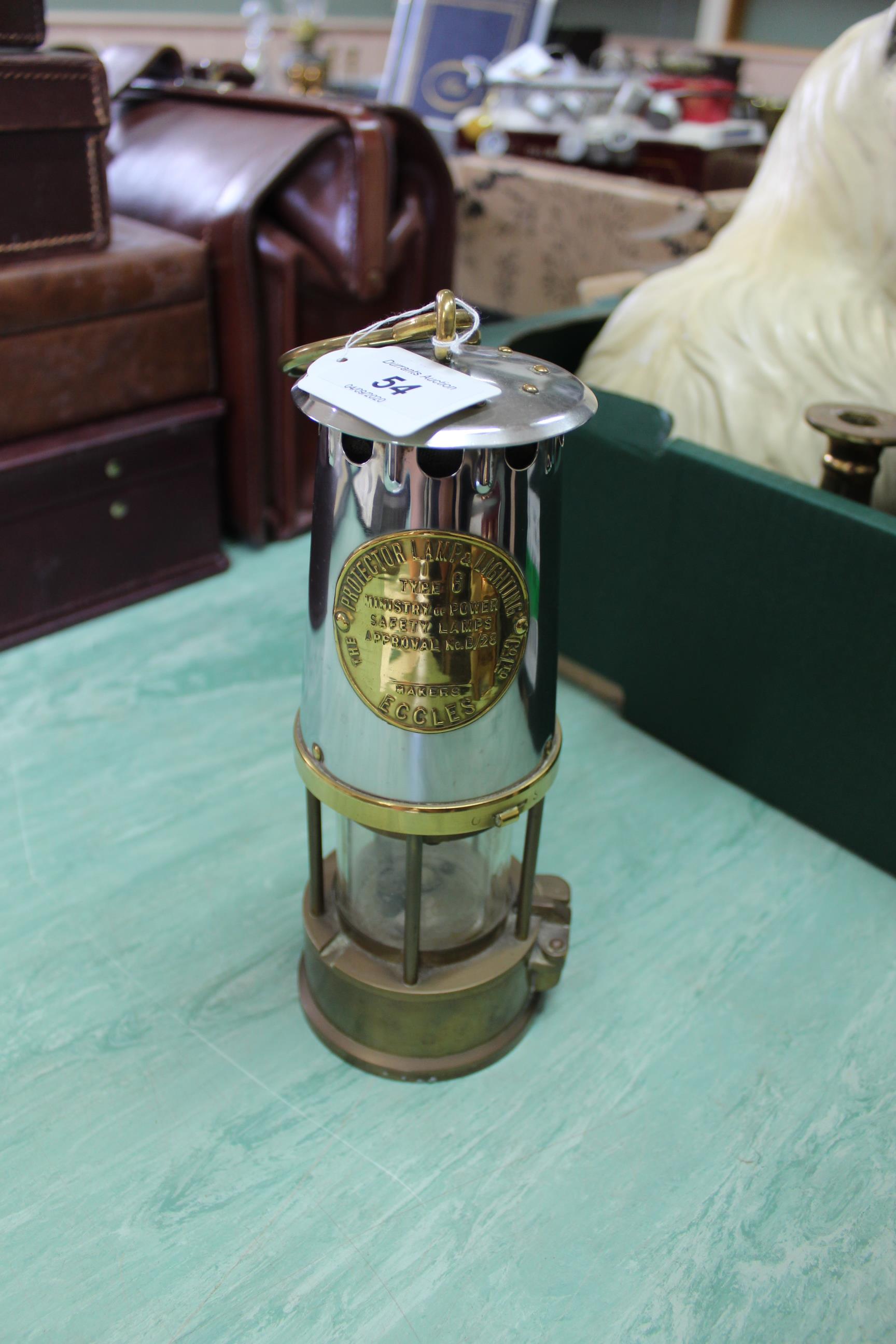 A brass and white metal miners lamp Type 6 protector lamp and Lighting Co Ltd,