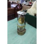 A brass and white metal miners lamp Type 6 protector lamp and Lighting Co Ltd,