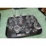 A tray of antique glassware including a pair of early 19th Century ale flutes,