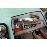 A tray with two wooden vices plus a small box of assorted tools