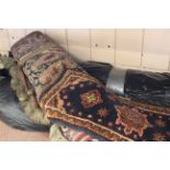 Five machine made Persian style rugs,