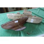 Two primitive model boats