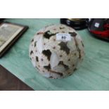 A glazed pottery pierced bowl decorated with moths and flowers,