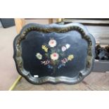 A large Victorian toleware tray of shaped rectangular form with painted flowers within a gilt