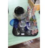 A tray of various coloured drinking glasses,