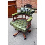 A Victorian style green leather captains chair