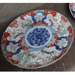 A late 19th Century Imari design charger (crack and repair visible)