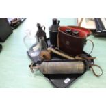 A tray with antique metal oil jugs, glass medicine jar, a pair of 'Nipole' 10x50 binoculars,