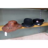 A London Fire Brigade hat plus a bowler and brown leather Australian style hat