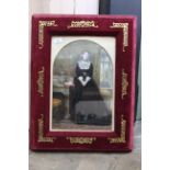 A late 19th Century watercolour portrait of a lady in a red velvet, brass mounted easel frame,