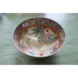 A 19th Century export bowl painted with courtiers in a garden setting (hair cracks)