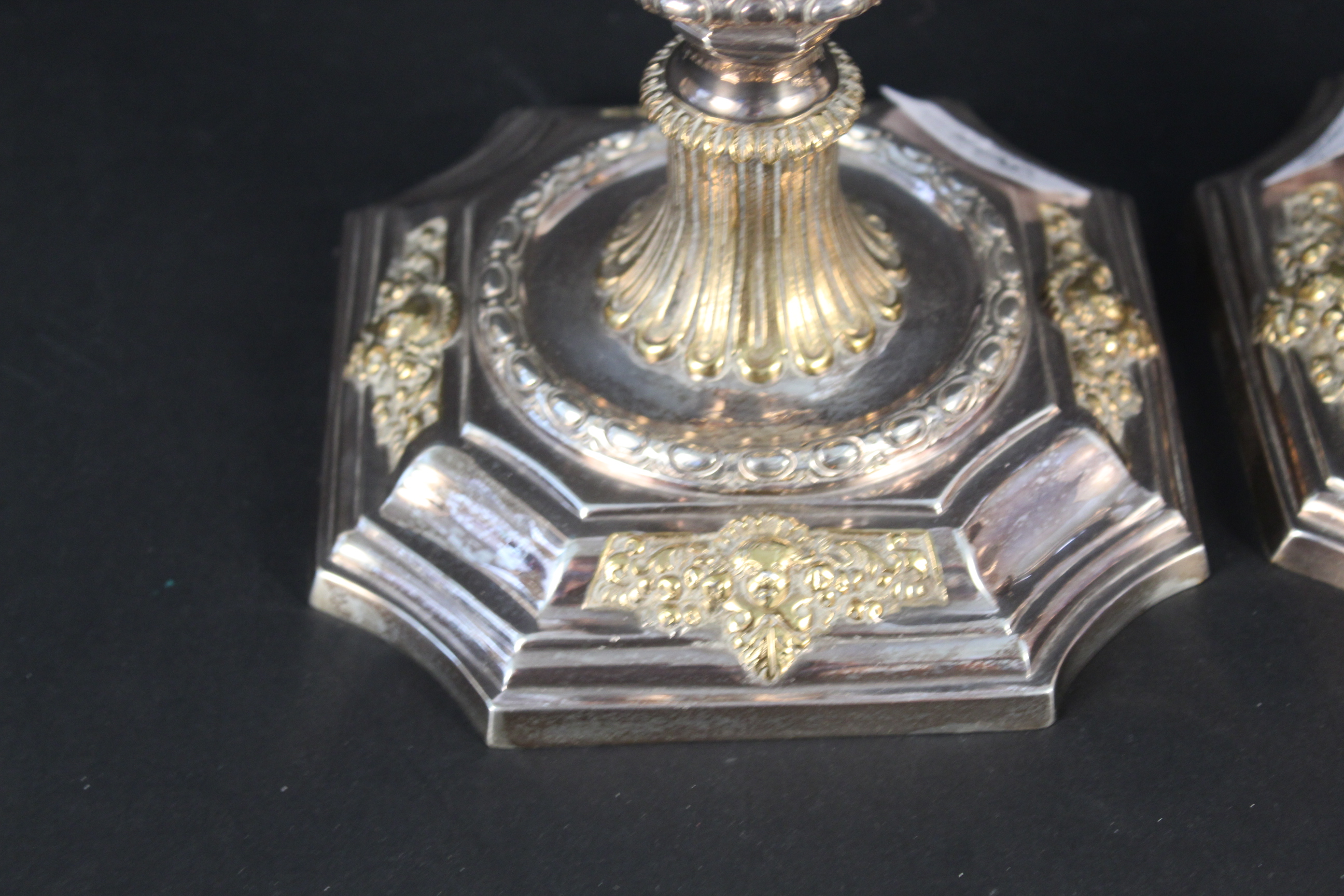 A pair of silver candlesticks with gilt floral and cherub decoration, - Image 2 of 3