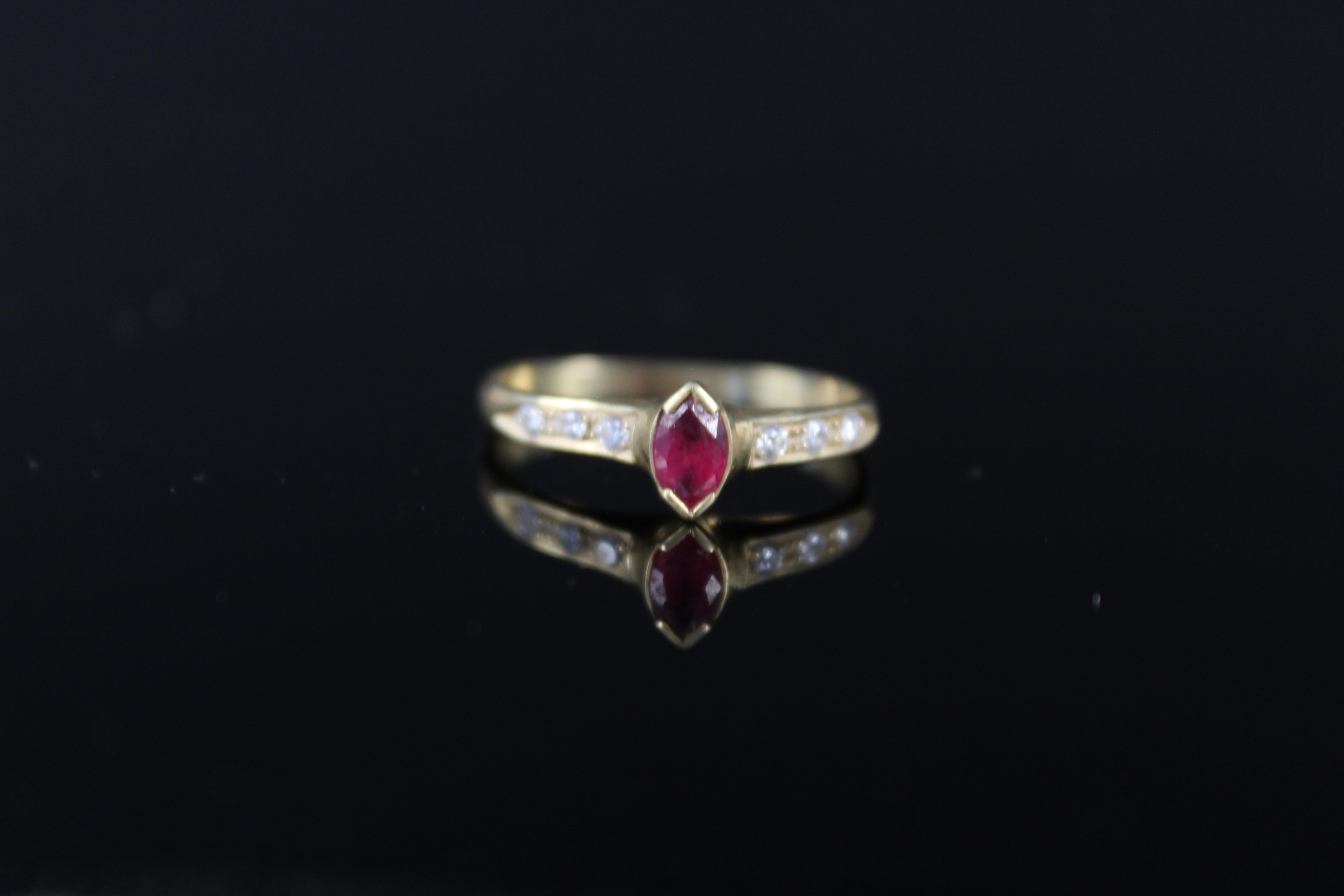 An 18ct gold red and white stone set ring (misshapen), approx 2.