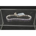 A silver tanzanite set line bracelet (approx 6.