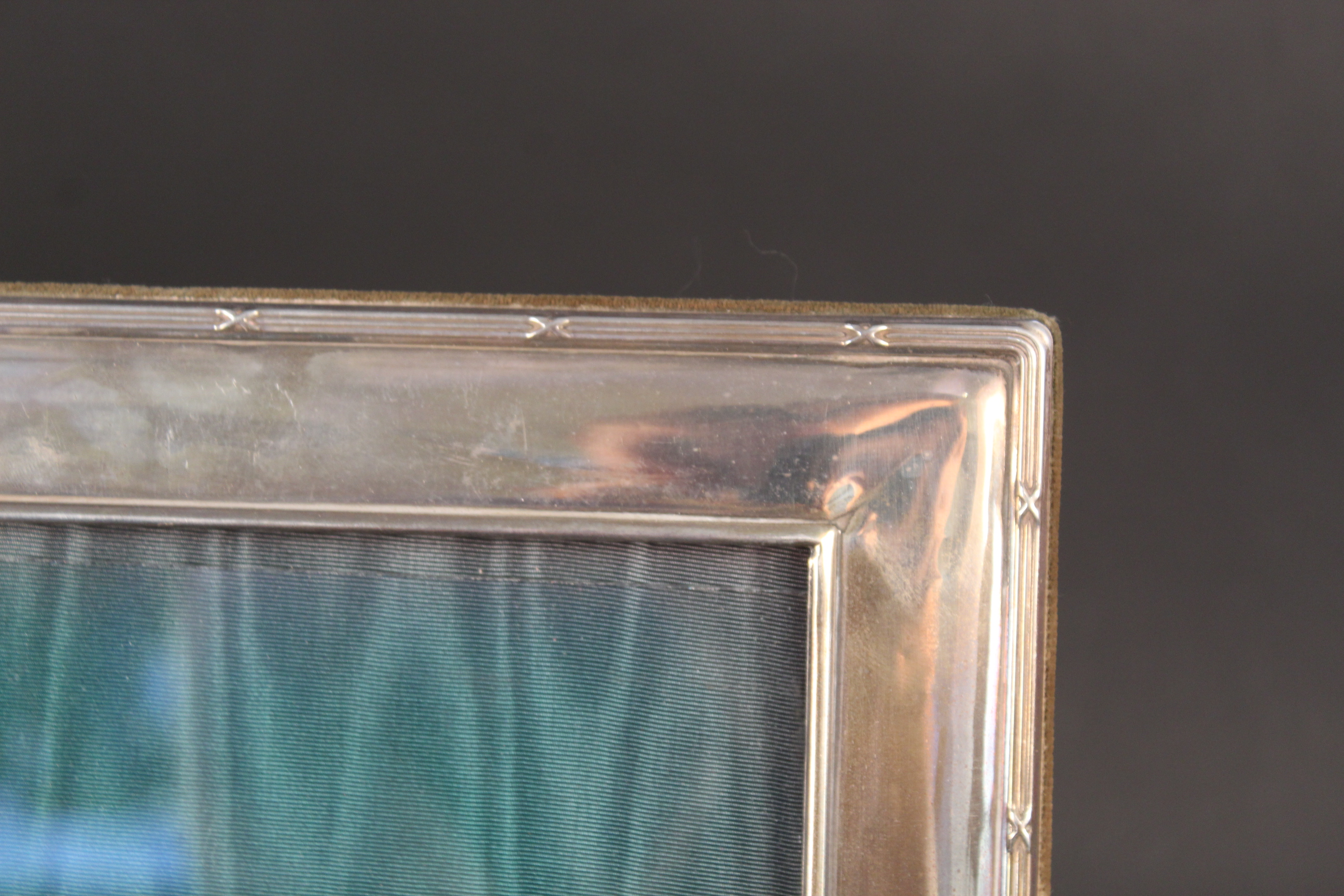 A large silver photograph frame with ribbed edge detail, - Image 2 of 3