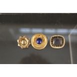 Three yellow metal brooches including lapis, target brooch,