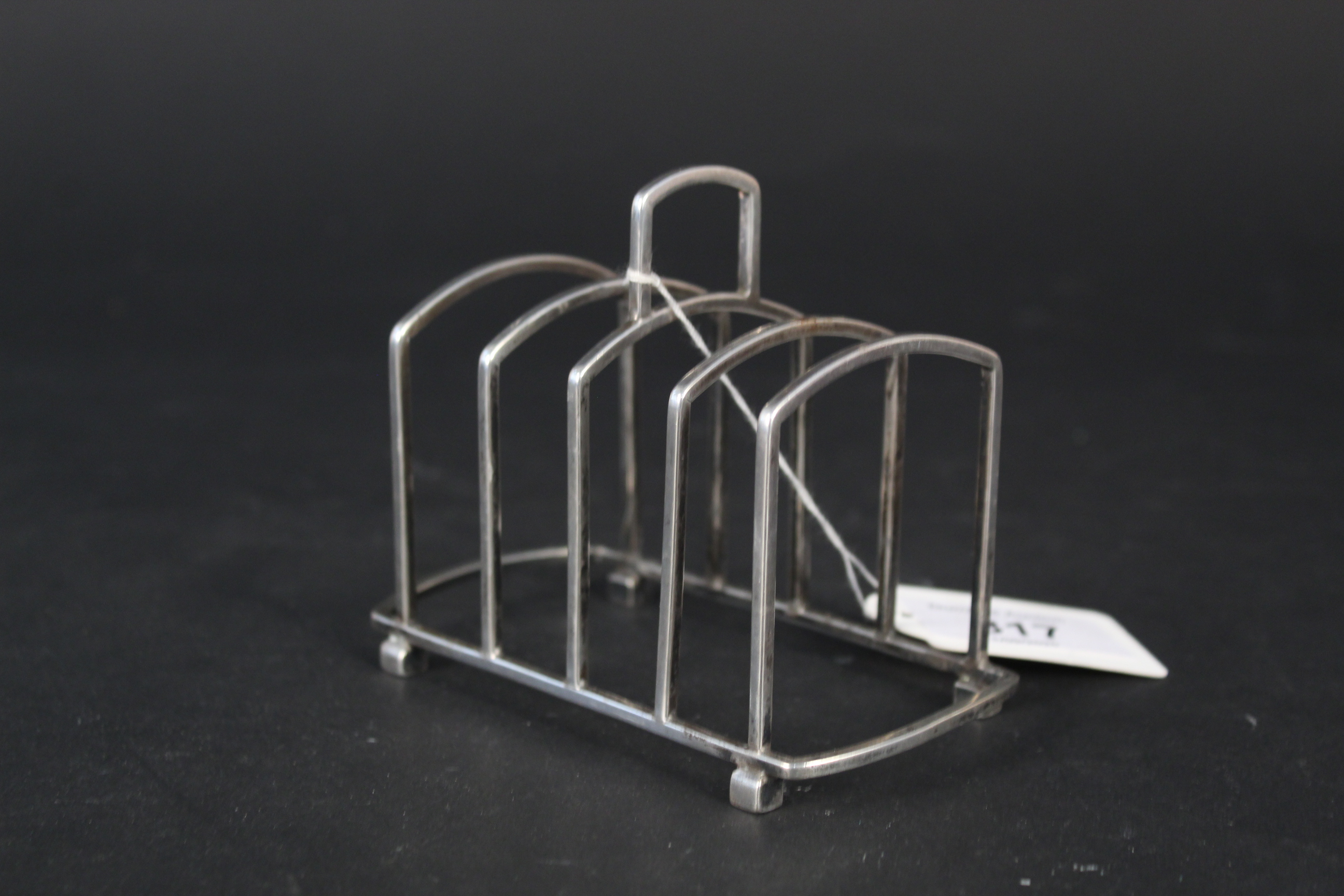 A silver four slice toast rack, Birmingham 1922 by Martin Hall & Co Ltd, - Image 2 of 3