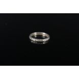 A white metal diamond set eternity ring, size J 1/2, approx 1.