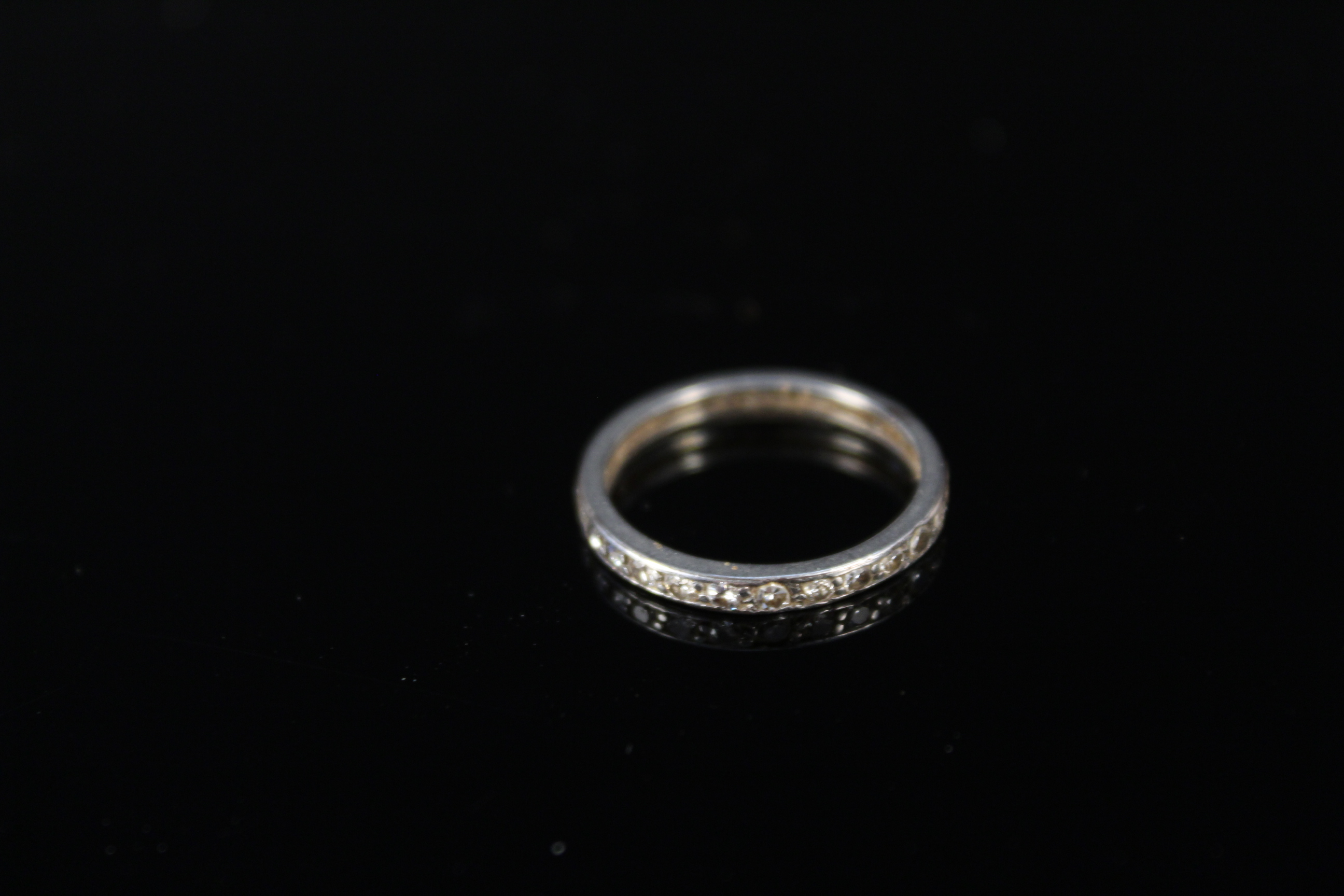 A white metal diamond set eternity ring, size J 1/2, approx 1. - Image 3 of 3