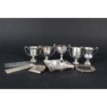 A mixed lot of silver items including five small trophy cups (all engraved), a silver ashtray,