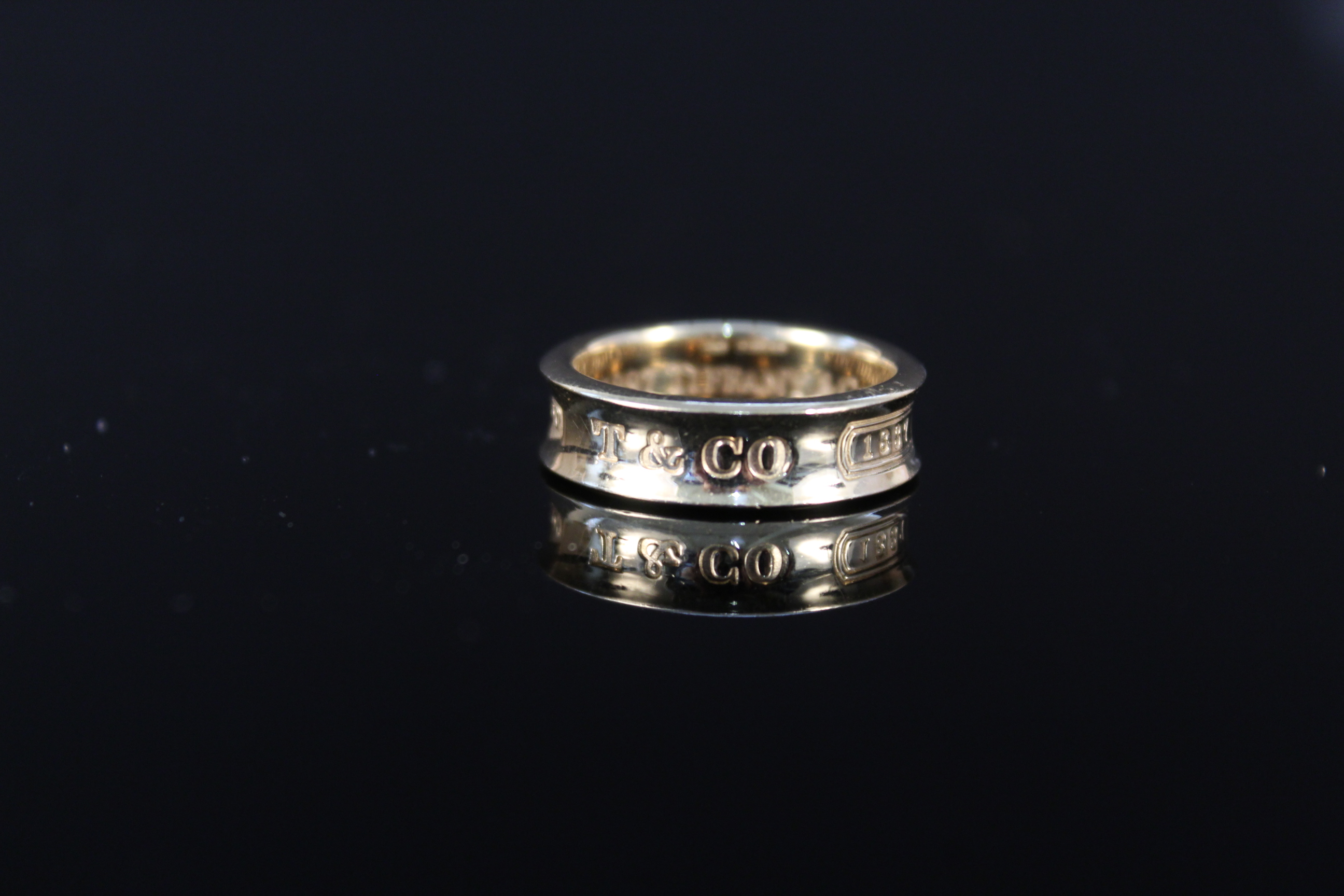 An 18ct gold Tiffany & Co 1837 band ring, size N,