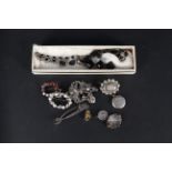 A mixed lot of silver and white metal jewellery including stone set brooches